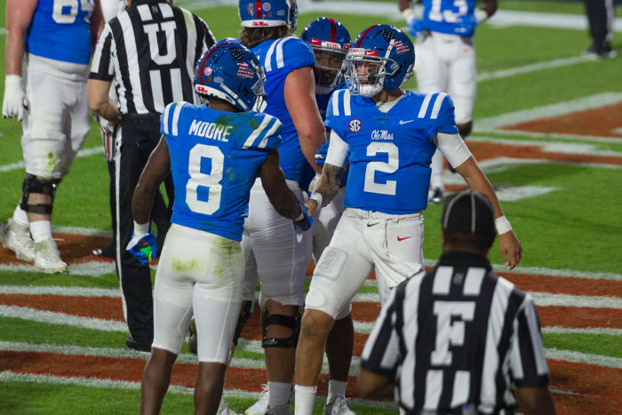 Nov 14, 2020; Oxford, Mississippi, USA; Mississippi Rebels quarterback Matt Corral (2) and wide receiver Elijah Moore (8) celebrate during the first half against the South Carolina Gamecocks at Vaught-Hemingway Stadium. Mandatory Credit: Justin Ford-USA TODAY Sports